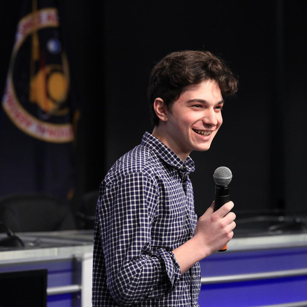 Julian Rubinfien, student winner of the Genes in Space competition, discusses his Genes in Space II winning experiment during a Whats on Board science briefing to NASA Social participants at NASAs Kennedy Space Center in Florida. The briefing was for Orbital ATKs seventh commercial resupply services mission, CRS 7, to the International Space Station. Orbital ATKs Cygnus pressurized cargo module is set to launch on the United Launch Alliance Atlas V rocket from Space Launch Complex 41 at Cape Canaveral Air Force Station on April 18. Liftoff is scheduled for 11:11 a.m. EDT.