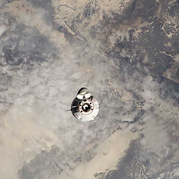 The SpaceX Dragon cargo vehicle approaches the International Space Station less than a day after launching from NASA's Kennedy Space Center loaded with over 7,000 pounds of science experiments, station hardware, and crew supplies.