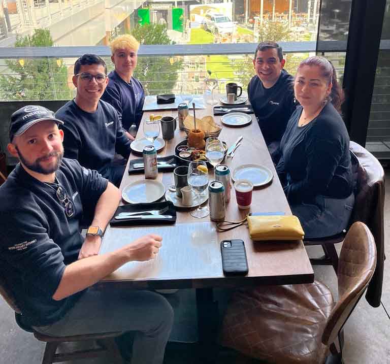 Alberto Montilla (back right) and Veronica Acosta (front right) with members of the Spatiam team in Allen, Texas.