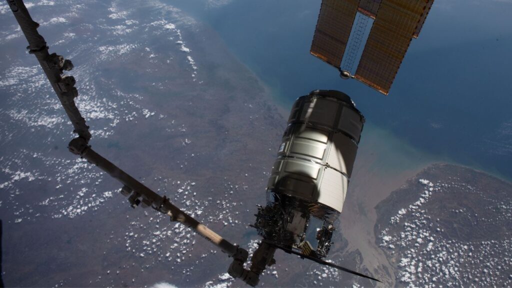 The Cygnus space freighter from Northrop Grumman is pictured in the grips of the Canadarm2 robotic arm as the International Space Station orbited 258 miles above the Arabian Sea coast of India in 2023.