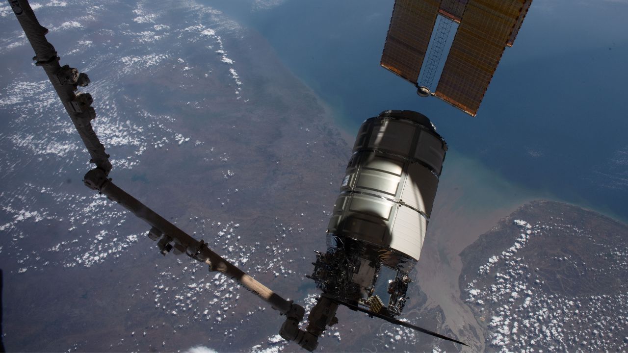 The Cygnus space freighter from Northrop Grumman is pictured in the grips of the Canadarm2 robotic arm as the International Space Station orbited 258 miles above the Arabian Sea coast of India in 2023.
