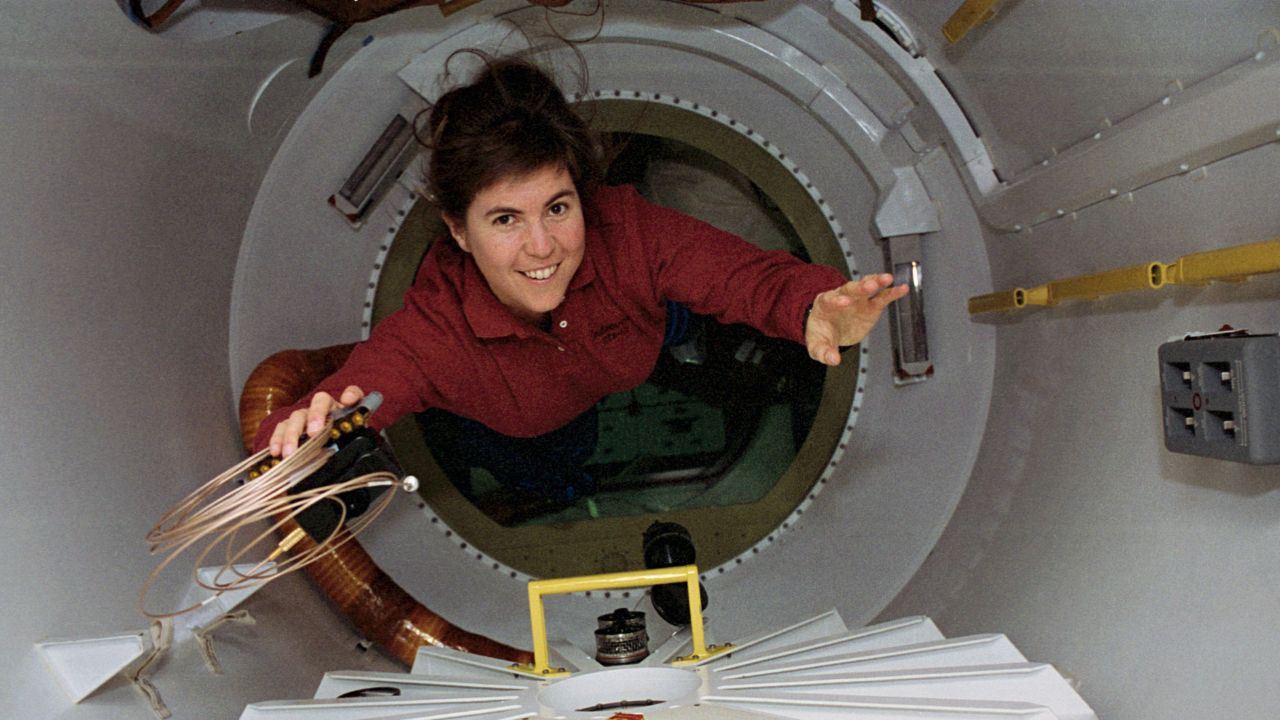 NASA astronaut Janice E. Voss, mission specialist, floated through a special tunnel into the SpaceHab module, circa 1993.