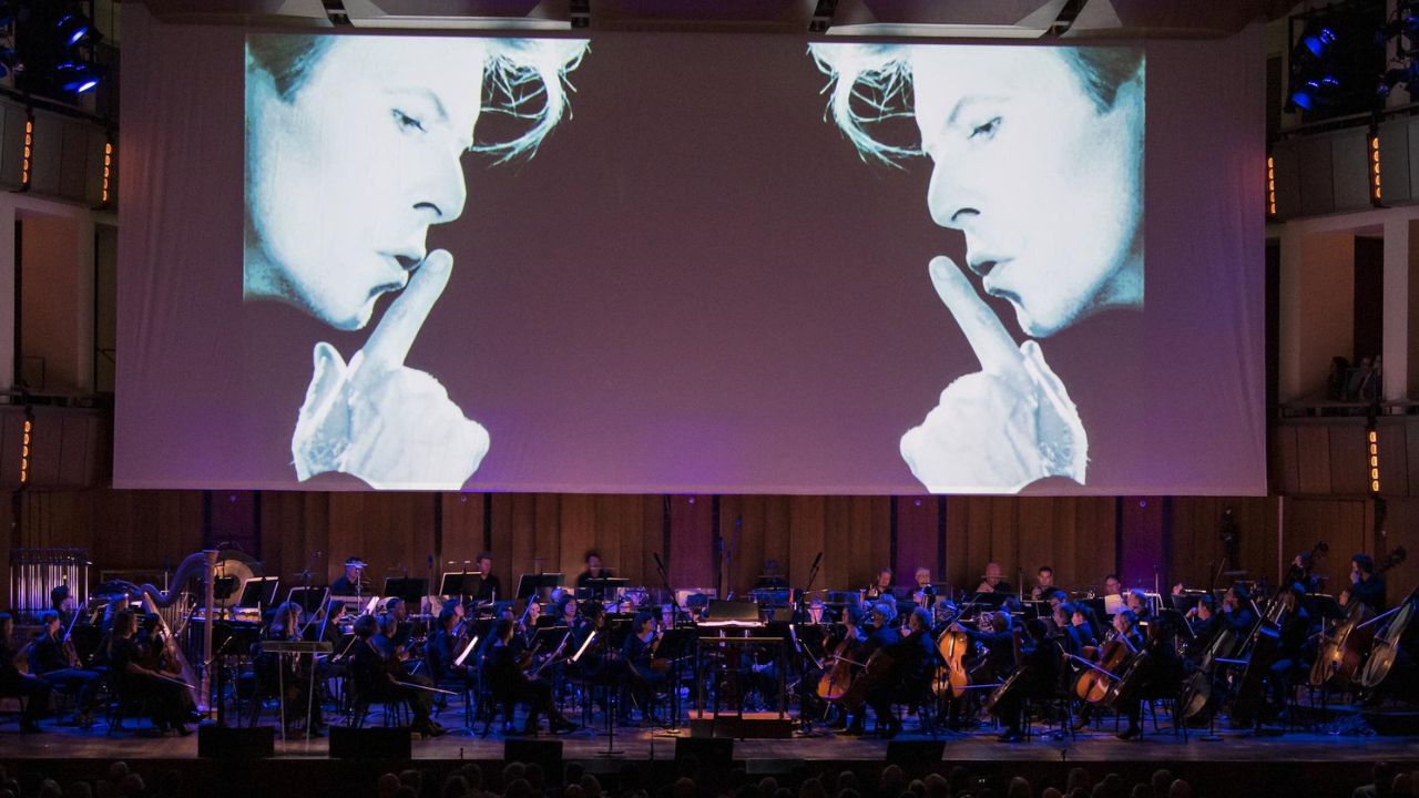 Music video for David Bowie’s “Space Oddity” debuts at Apollo 11 50th anniversary event.