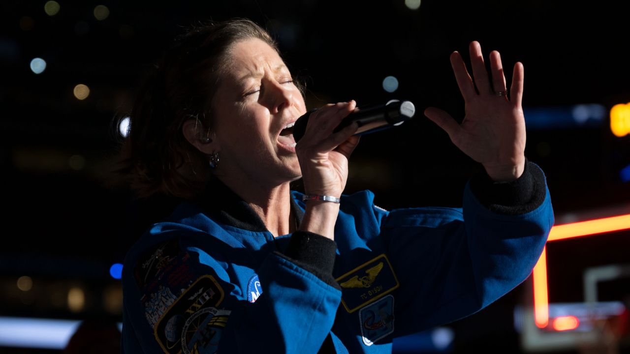 tracy-anthem (1) Astronaut Tracy Caldwell Dyson sang the national anthem.