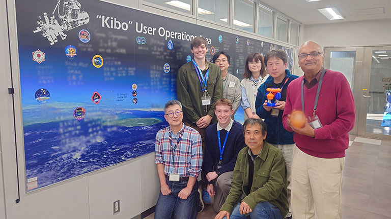 University of Florida team members Jason Livesay (back, far left), Ranga Narayanan (back, far right) and Thomas Corbin (front, center) with JAXA colleagues after completing their NASA-sponsored molten metals investigation.