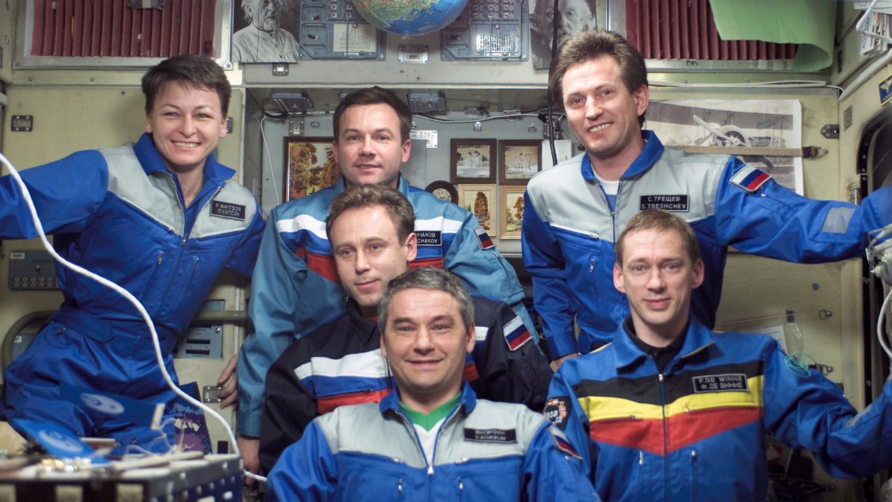 Whitson-1280x720 The Expedition Five and Soyuz 5 Taxi crews pose for a group photo in the Zvezda Service Module on the ISS. Whitson (far left), was the first woman to serve on station for an extended period of time.