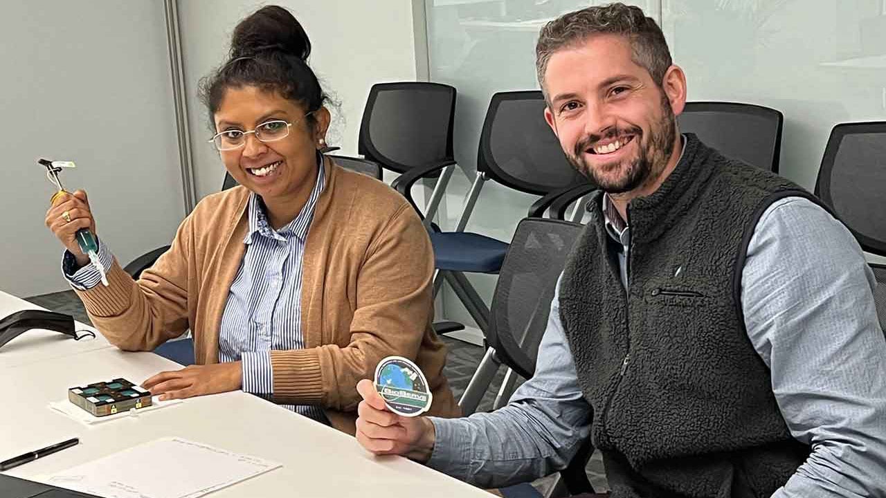 Axonis researchers Tia Dey and Shane Hegarty preparing for the team's ISS National Lab-sponsored investigation.