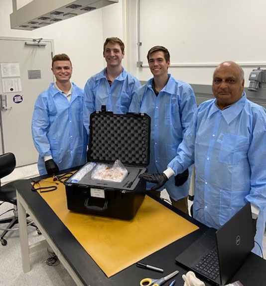 Case-study-vibrating-fluids-team-v2 The University of Florida team at Kennedy Space Center preparing its ISS National Lab-sponsored and NSF-funded investigation for launch. (left to right: Craig Singiser, Zach Karpinski, Jason Livesay, Ranga Narayanan)