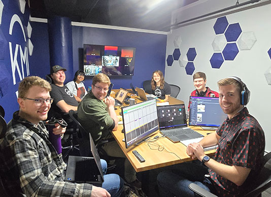 The KMI technical team set up to conduct REACCH testing on the ISS from their Michigan office (left to right: Tom Ziegler, Sam Cassidy, Preksha Madhva, Zachery Champion, Rose Schopfer, Adam Kall, Austin Morris).