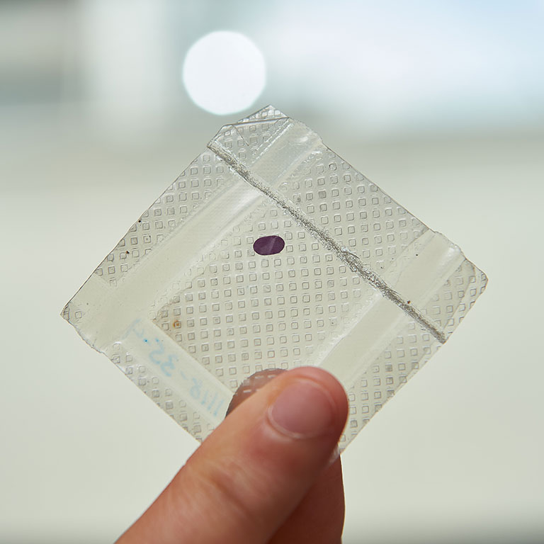 case-study-lambdavision-artificial-retina LambdaVision’s protein-based artificial retina, the small purple dot, is about the size of a paper hole punch.